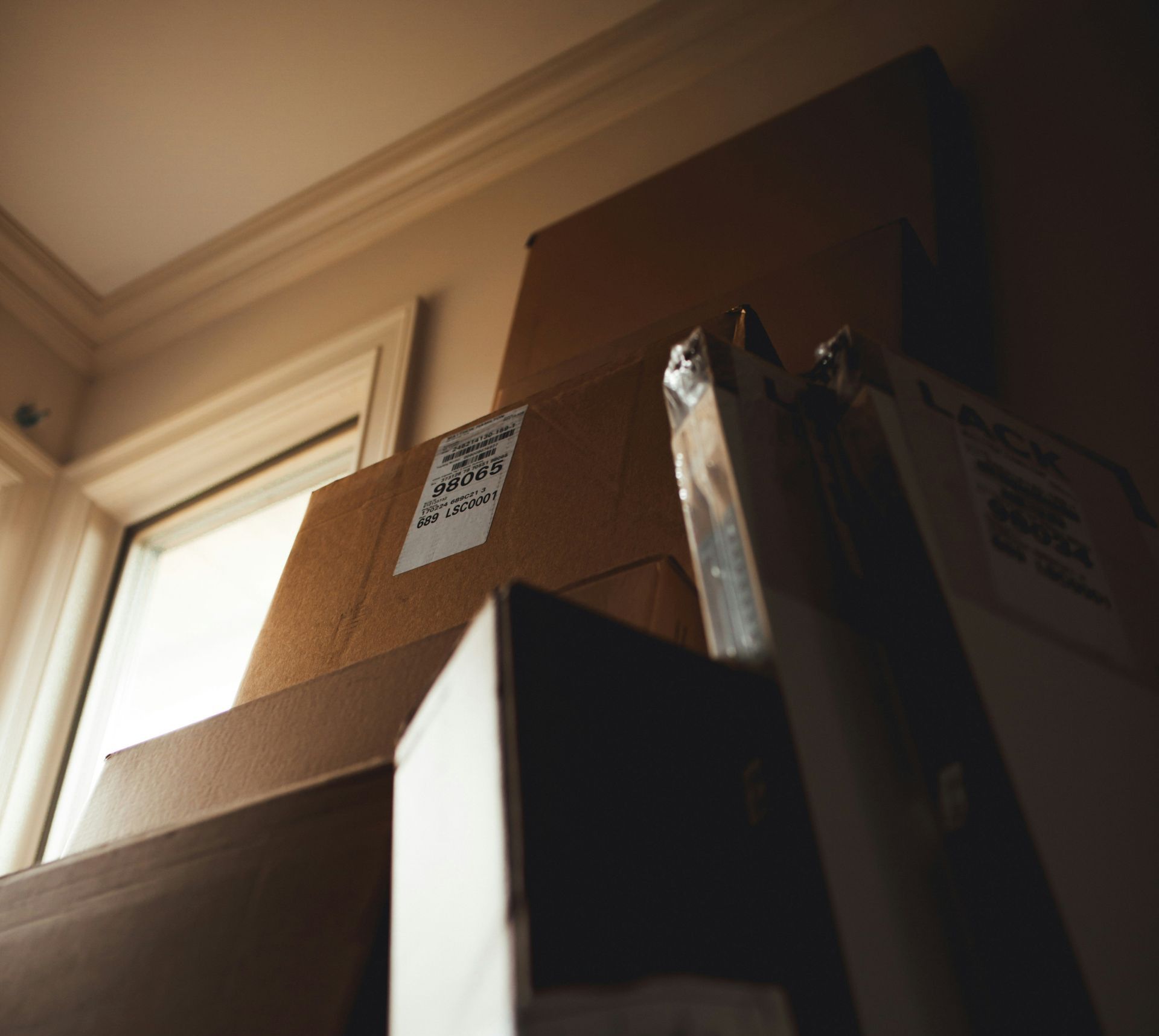 boxes leaning on cardboard box